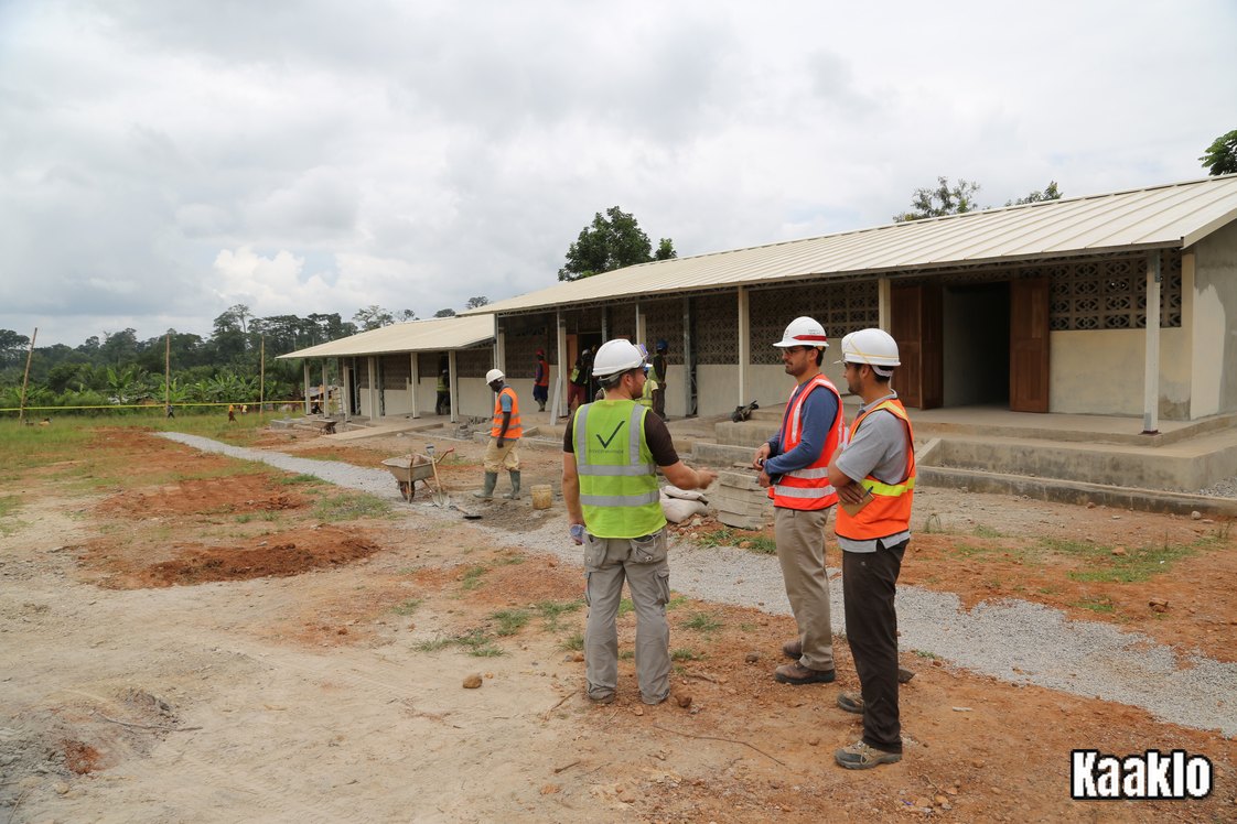 Construction workers and engineers on a school building site in Grumesa, Ghana.