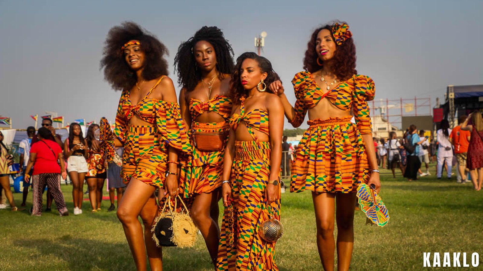 A large crowd at the Afrochella festival in Accra, with flags and stage lighting.