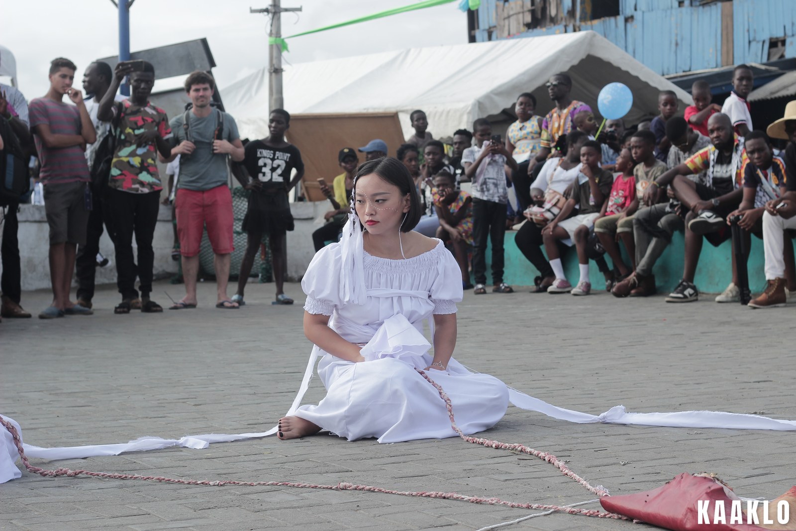 Performers on a stage in Accra during a live arts performance.