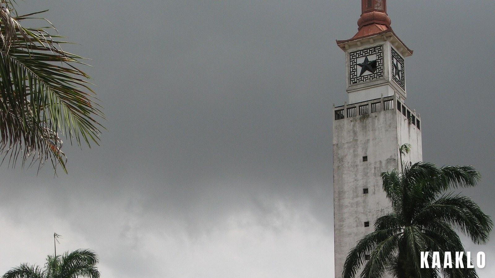 The clock tower on the University of Ghana campus at Legon against an overcast sky.