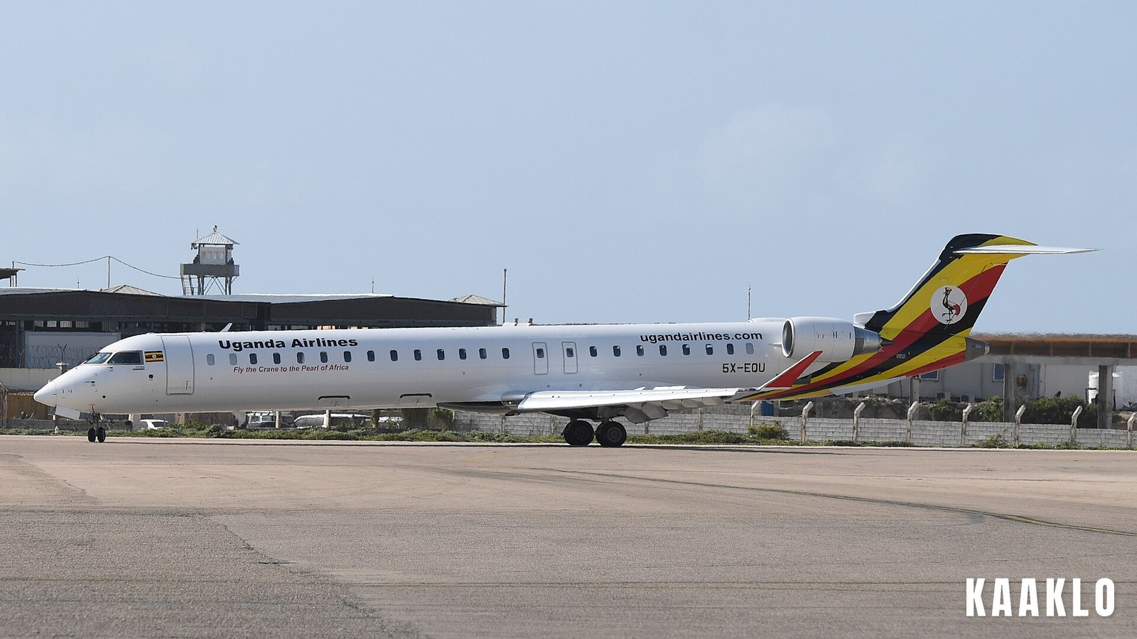 A Uganda Airlines Bombardier CRJ-900 aircraft on the tarmac.